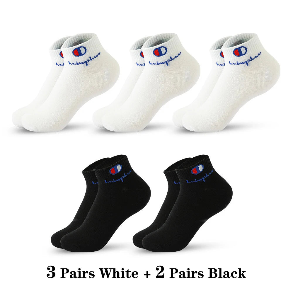 Three pairs of white ankle socks and two pairs of black ankle socks