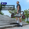 A man is using an OBX one-step folding electric scooter on outdoor steps.