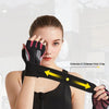 A woman wearing black fingerless weightlifting gloves with a wrist safety support strap on her wrist.