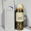 A gold and black insulated stainless steel sports water bottle with a white cap is shown next to its packaging box.