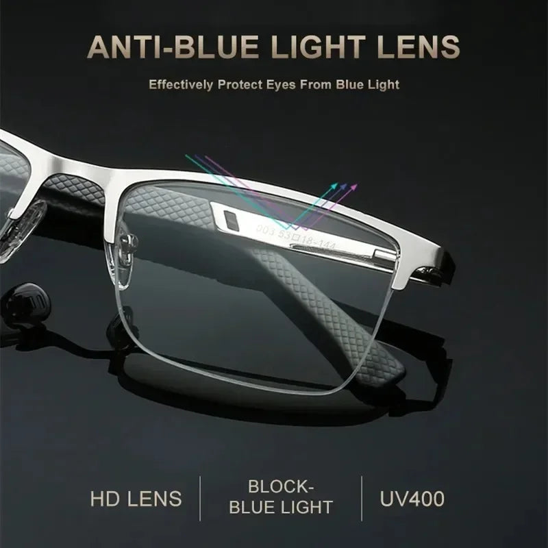 A pair of silver-framed anti-blue light reading glasses with a clear lens displayed on a dark background.