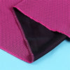 A close-up of a magenta microfiber cooling towel folded, showing the textured fabric and a dark purple lining.
