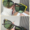 Yellow stripe/green vintage square cat eye sunglasses with UV400 protection being held by a hand