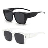 A pair of black sunglasses with thick frames and dark lenses shown from the front.