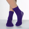 Purple yoga socks with a sheer mesh pattern on the toe area