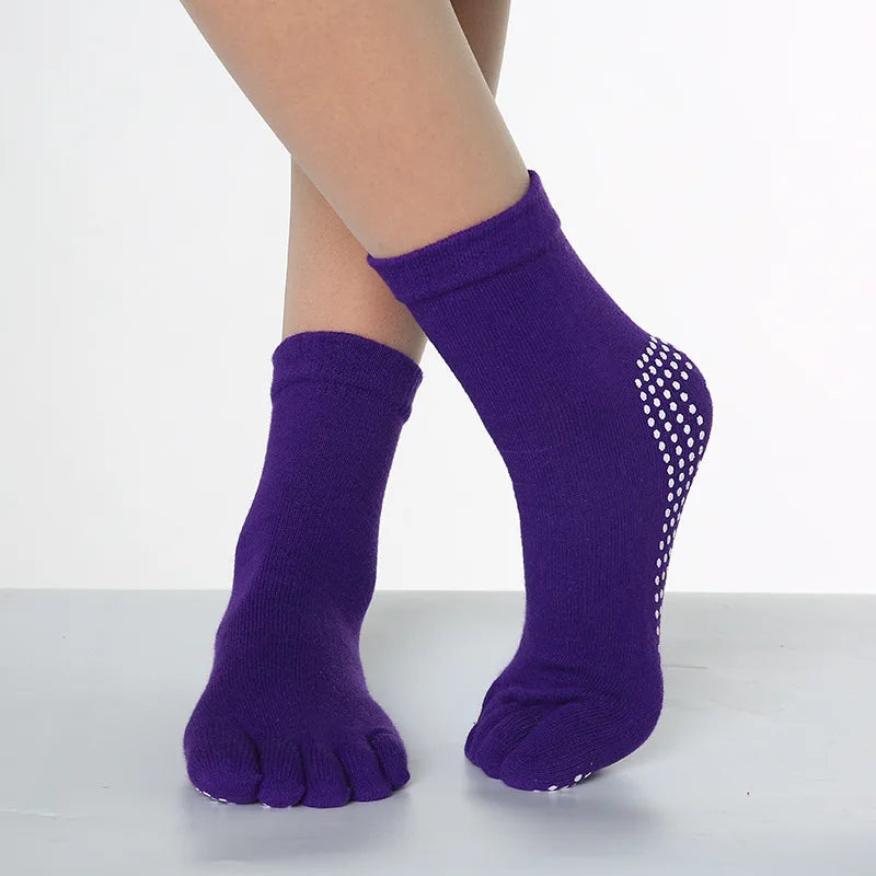 Purple yoga socks with a sheer mesh pattern on the toe area