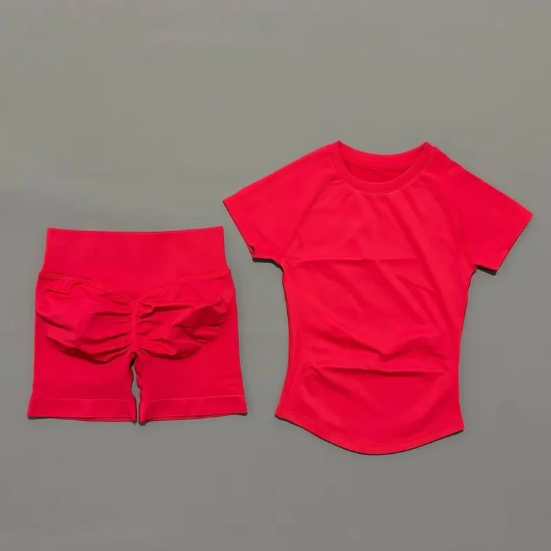 A bright red seamless yoga set for women featuring a short sleeve top and workout leggings.
