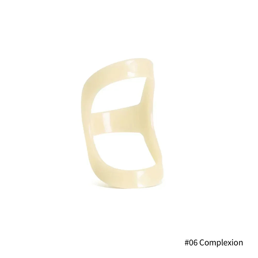 A beige ergonomic finger splint designed for joint support.