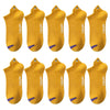 A set of yellow men's breathable ankle boat socks with purple accents.