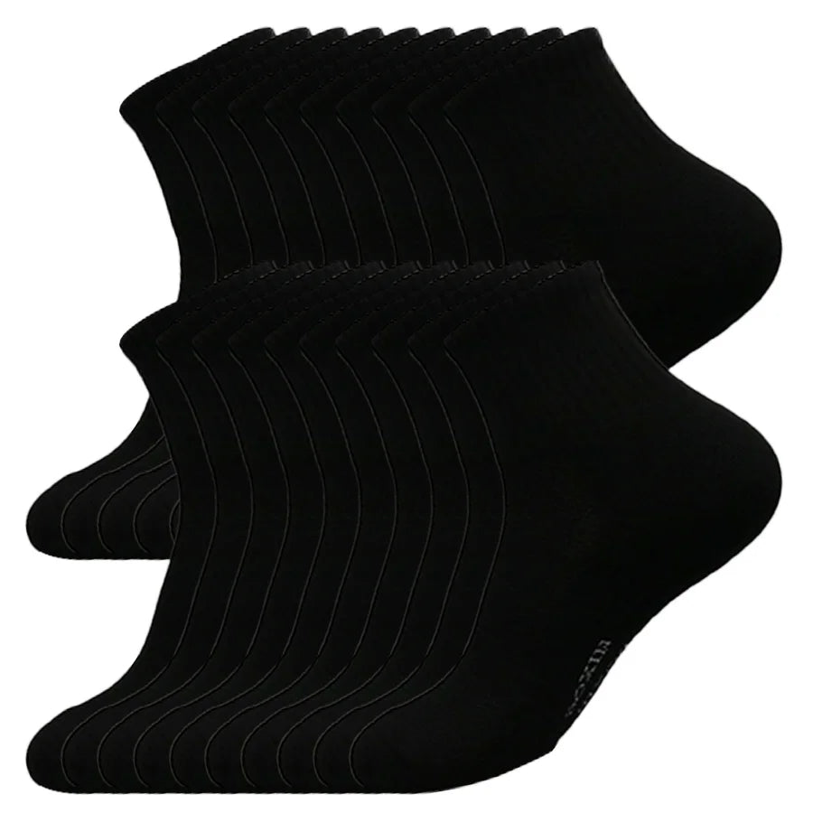 A stack of black men's essential warm socks for outdoor activities.