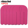Ten pink kinesiology tapes arranged in a row for sports recovery.