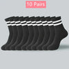 Dix paires de chaussettes en maille noires à mi-mollet pour femmes, empilées horizontalement.