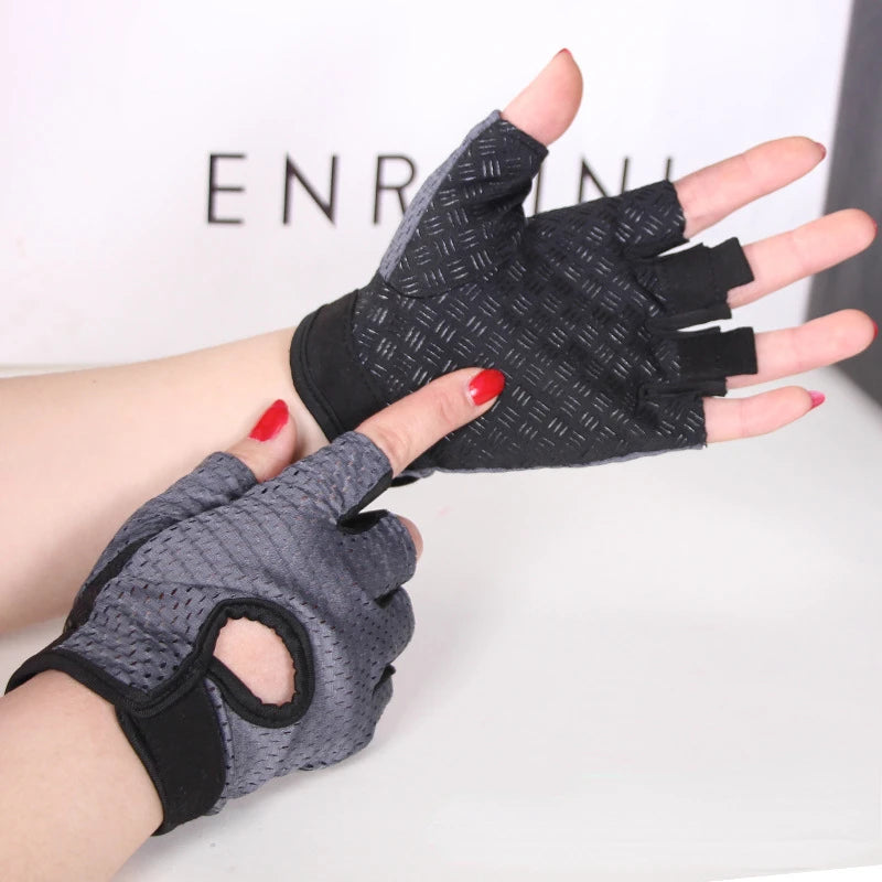 A hand wearing black and gray anti-slip fingerless gym gloves with wrist support.