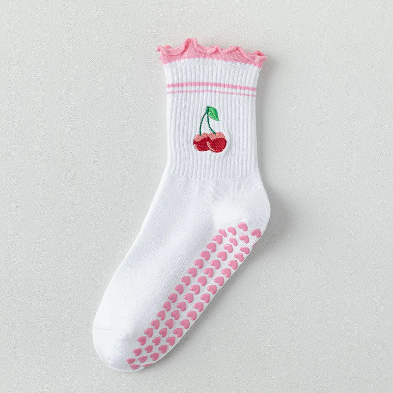 Chaussettes de yoga blanches avec broderie rose et détails antidérapants