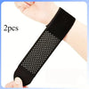 Two black ultra-thin wrist support straps being held by a hand.
