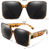 A pair of brown leopard print square sunglasses shown in front view at a 45-degree angle.