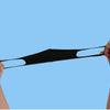 Hands holding a black UV protection face mask for summer and travel