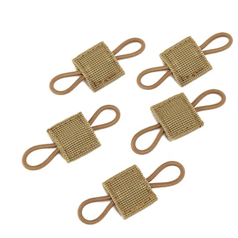 A multi-pack of tactical antenna binding buckles made of tan woven fabric.