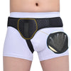 Black inguinal hernia support belt with compression pads worn on a person's abdomen and groin area.