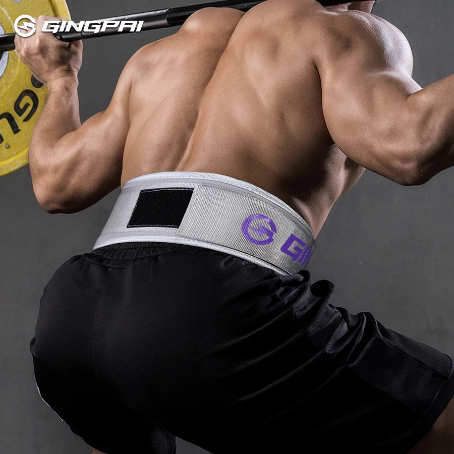 A muscular man wearing a gray fitness lifting belt is shown performing an exercise.