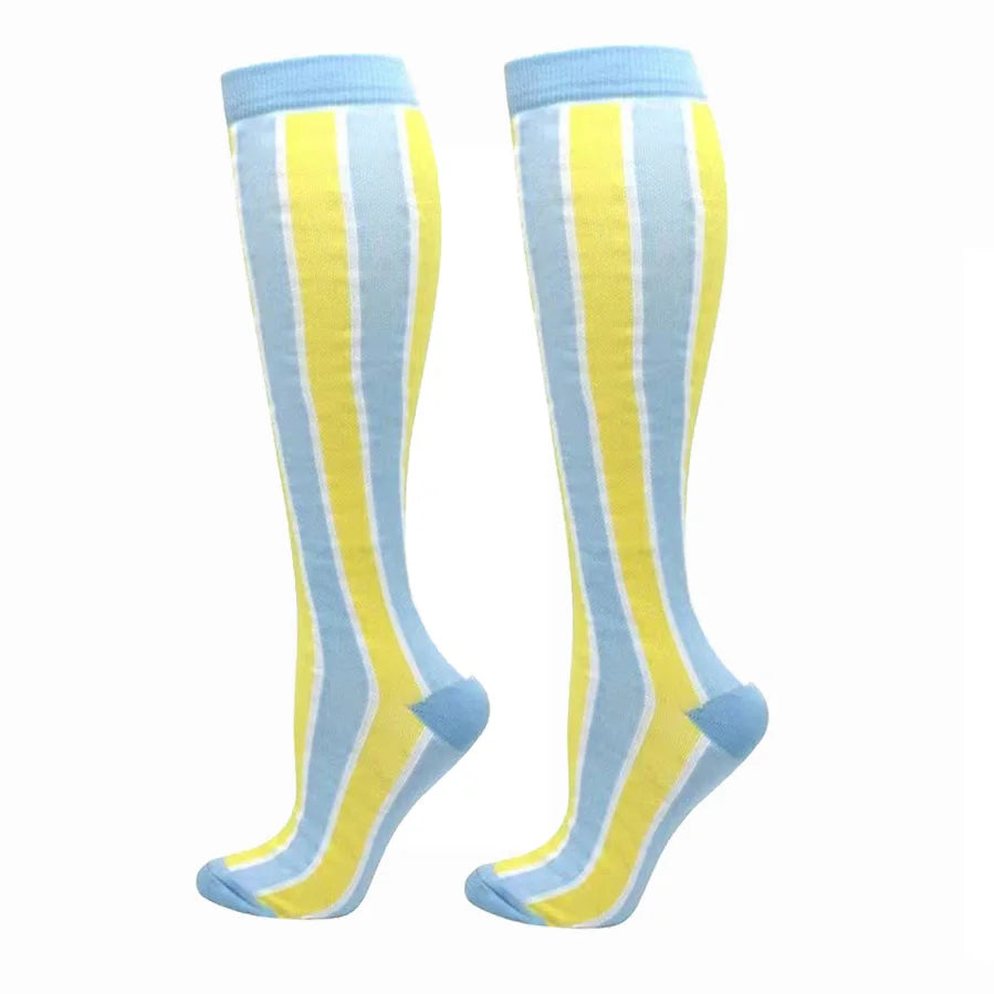 A pair of light blue and yellow striped compression elastic socks for sports and daily wear.