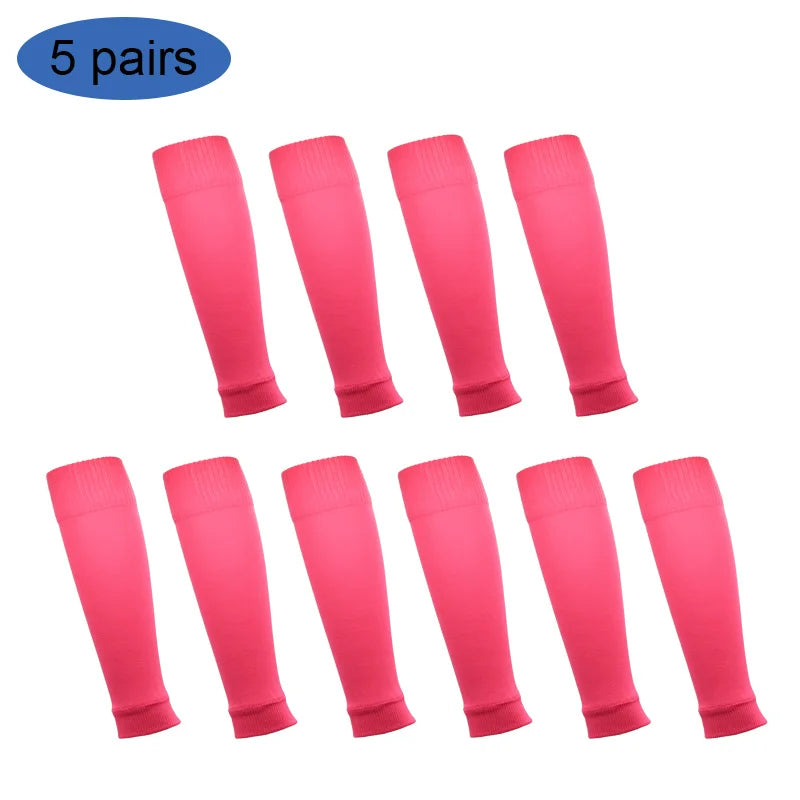 Five pairs of pink football shin guards for leg protection