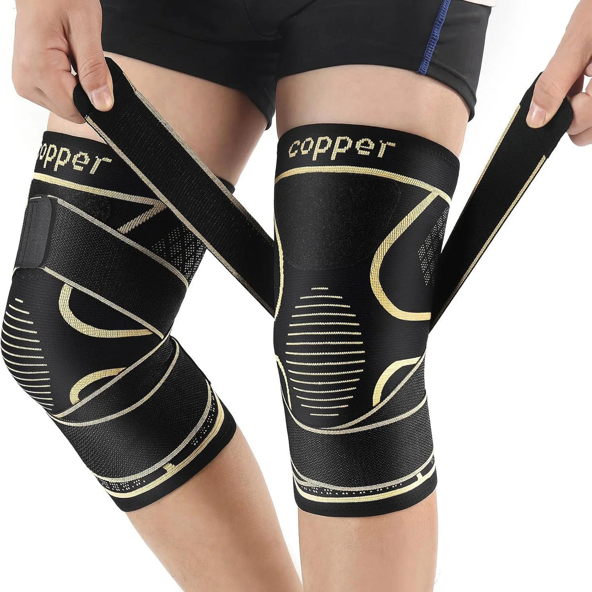 Black copper knee braces worn on a person's leg for pain relief.