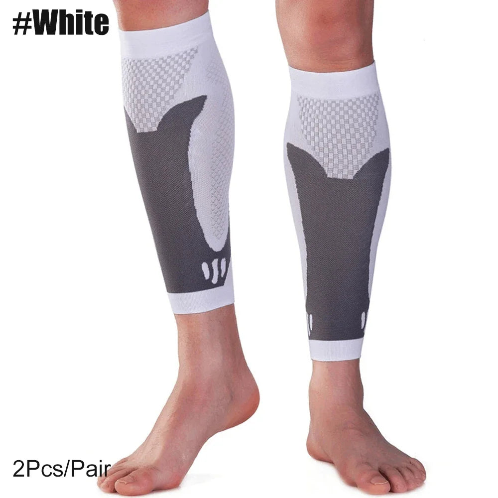 A pair of white calf compression sleeves for sports and daily wear shown on a leg.