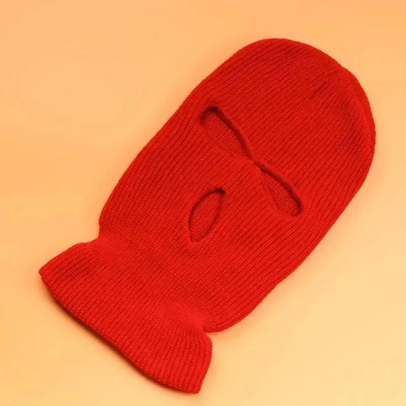 A bright red tactical knit balaclava beanie hat shown from a top-down angle.