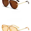 Brown tinted fashion protective sunglasses with gold-toned metal arms