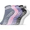 A row of colorful non-slip grip socks for yoga and pilates in various shades of gray, pink, purple, black, and white.