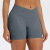 A model wearing seamless high-waist yoga leggings in a slate gray color.