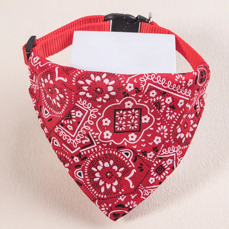 Red patterned bandana or scarf for pets with a white tag attached