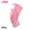 Pink knee compression sleeve with a white pad and textured fabric