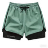 Light mint green athletic shorts with black trim and drawstring