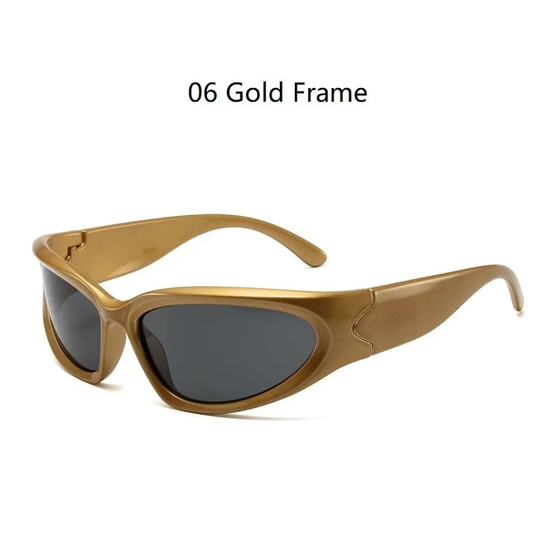 A pair of gold frame sunglasses with dark lenses shown against a white background.