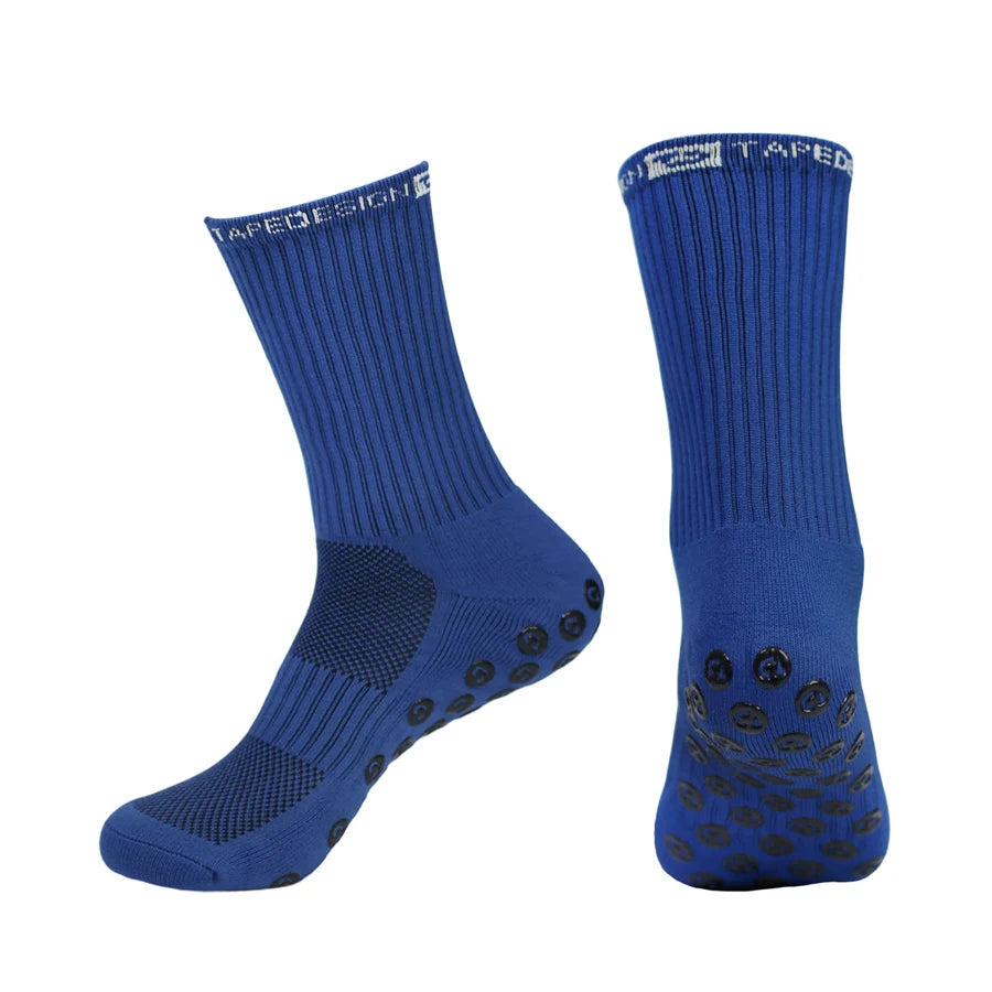 A pair of blue performance sports gripping socks shown from the side.