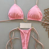 A pink halter bikini set for women displayed against a light gray background.