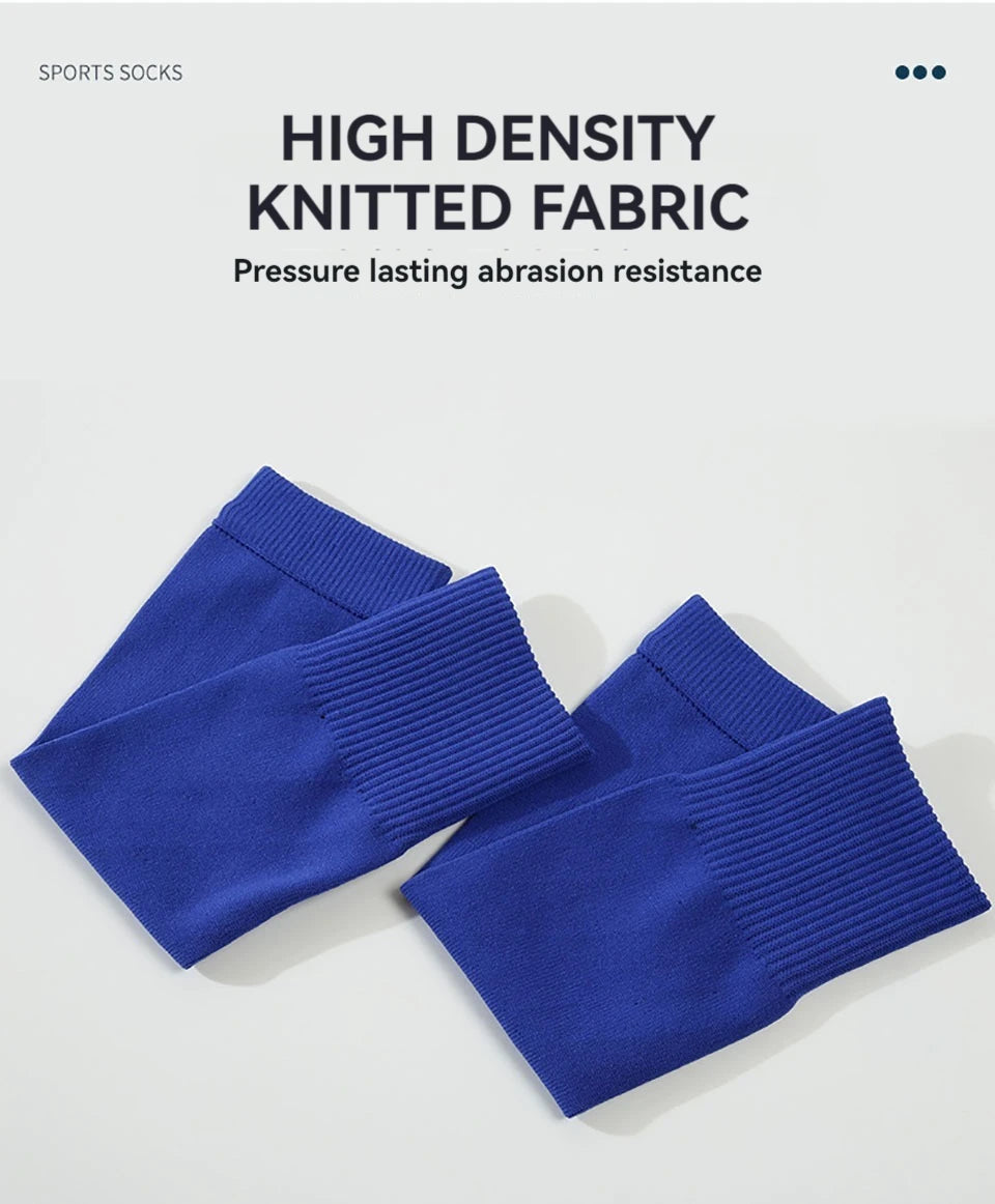 A pair of royal blue sports socks featuring a high-density knitted fabric for lasting abrasion resistance.