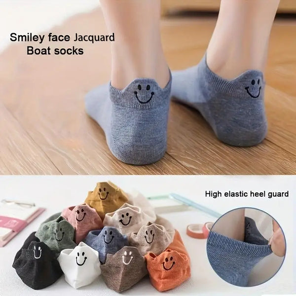 Eight pairs of grey and brown jacquard boat socks with smiling embroidery shown next to a close-up of an elastic heel guard.