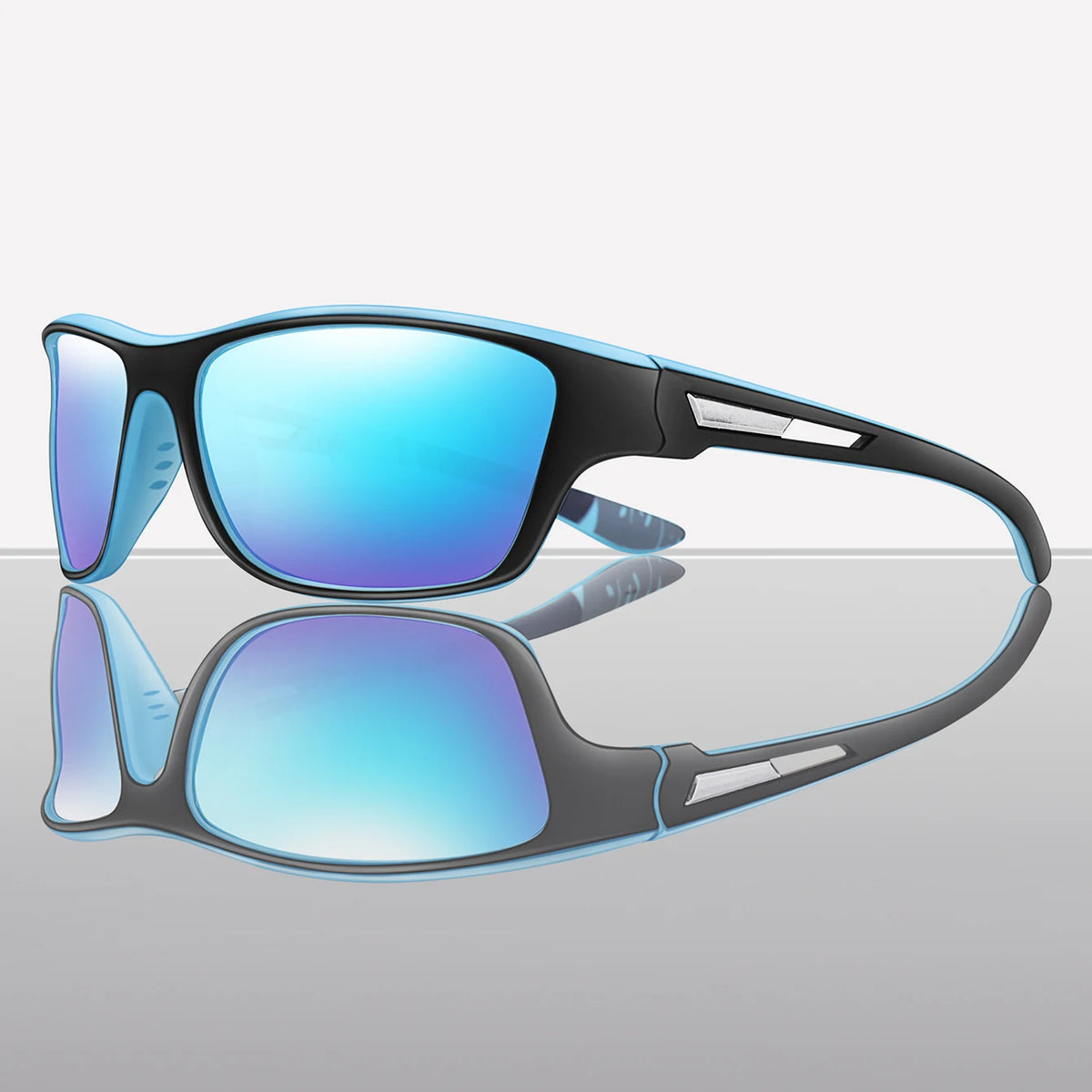 A pair of blue-tinted polarized cycling sunglasses resting on a reflective surface.