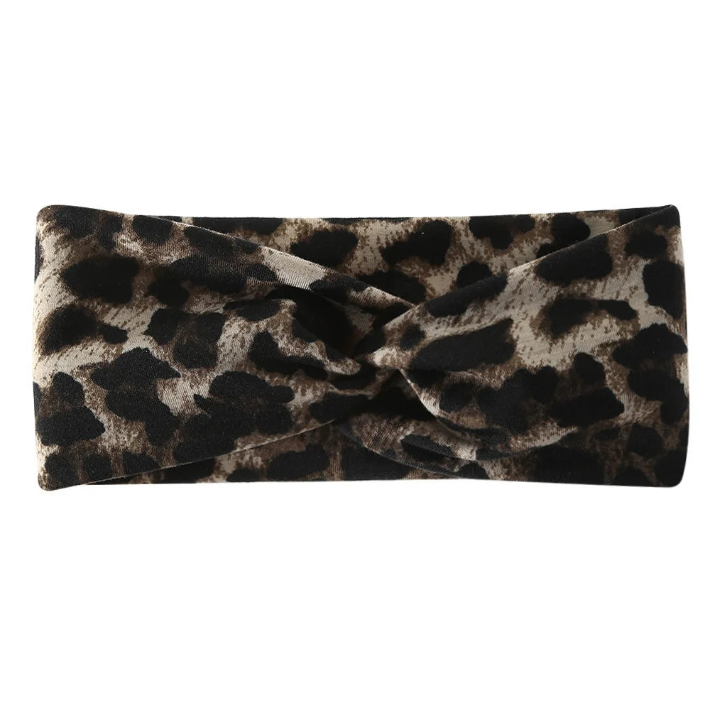 A black and brown leopard print wide headband for yoga and running.