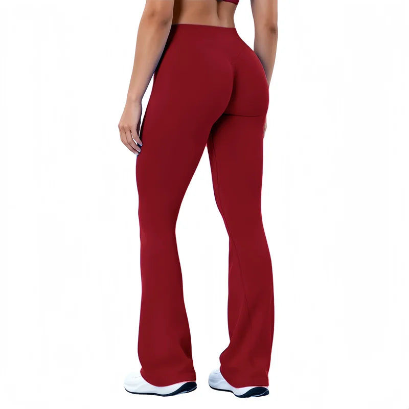 A model wearing maroon seamless flared yoga leggings with white trim.