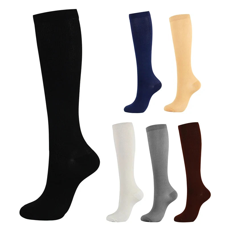 A collection of compression socks in black, navy blue, beige, gray, and brown.
