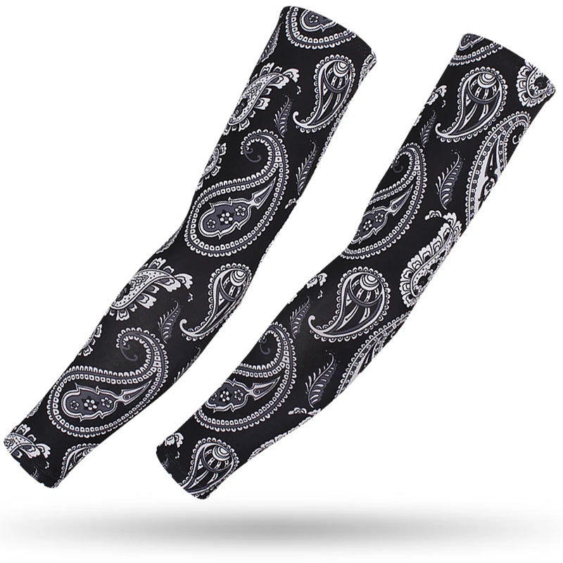 A pair of black patterned sports arm sleeves with paisley designs shown diagonally.
