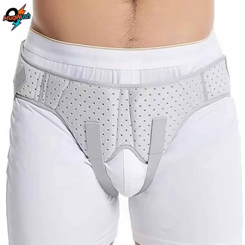 Gray hernia support belt worn around the waist of a person wearing white underwear and pants.