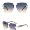 A pair of light luxury frameless sunglasses with gold accents shown in a positive and side display.