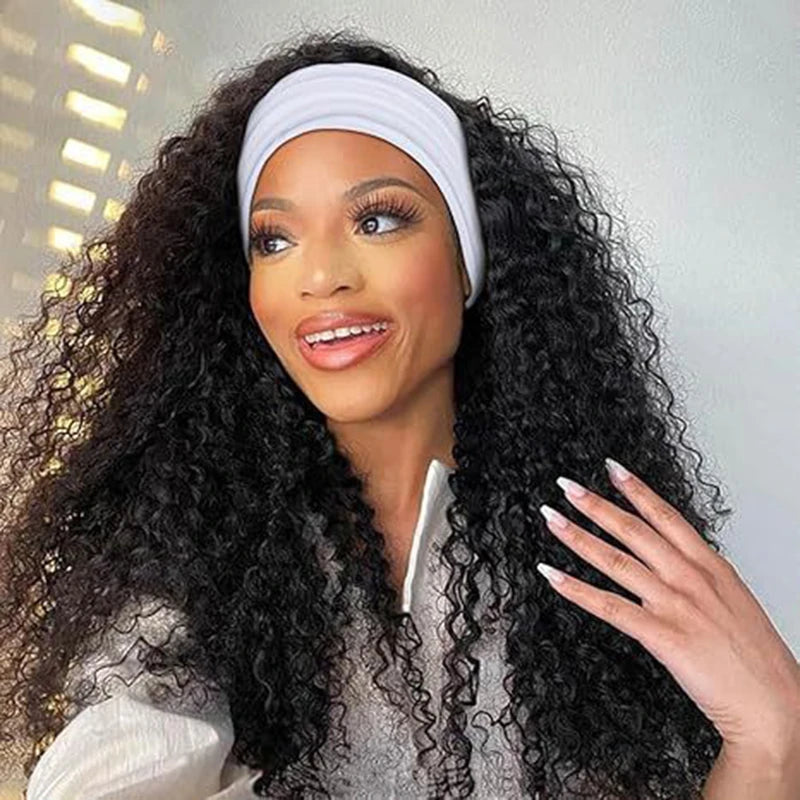 A woman with long dark curly hair wearing a white bow headband looking to the side.