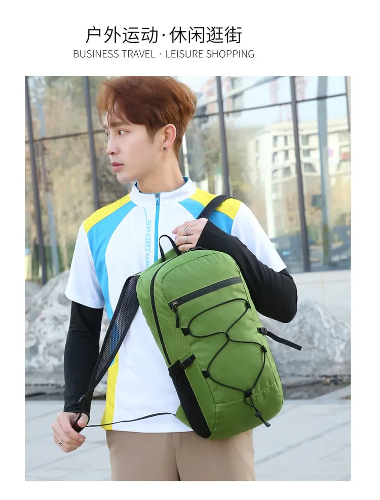 A young man wearing a white and yellow athletic jacket carrying a large olive green waterproof hiking backpack outdoors.