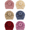 Eine Kollektion von fünf aus festem Baumwoll-Baby-Turban-Headwraps in Rosa, Beige, Blau und Rot.